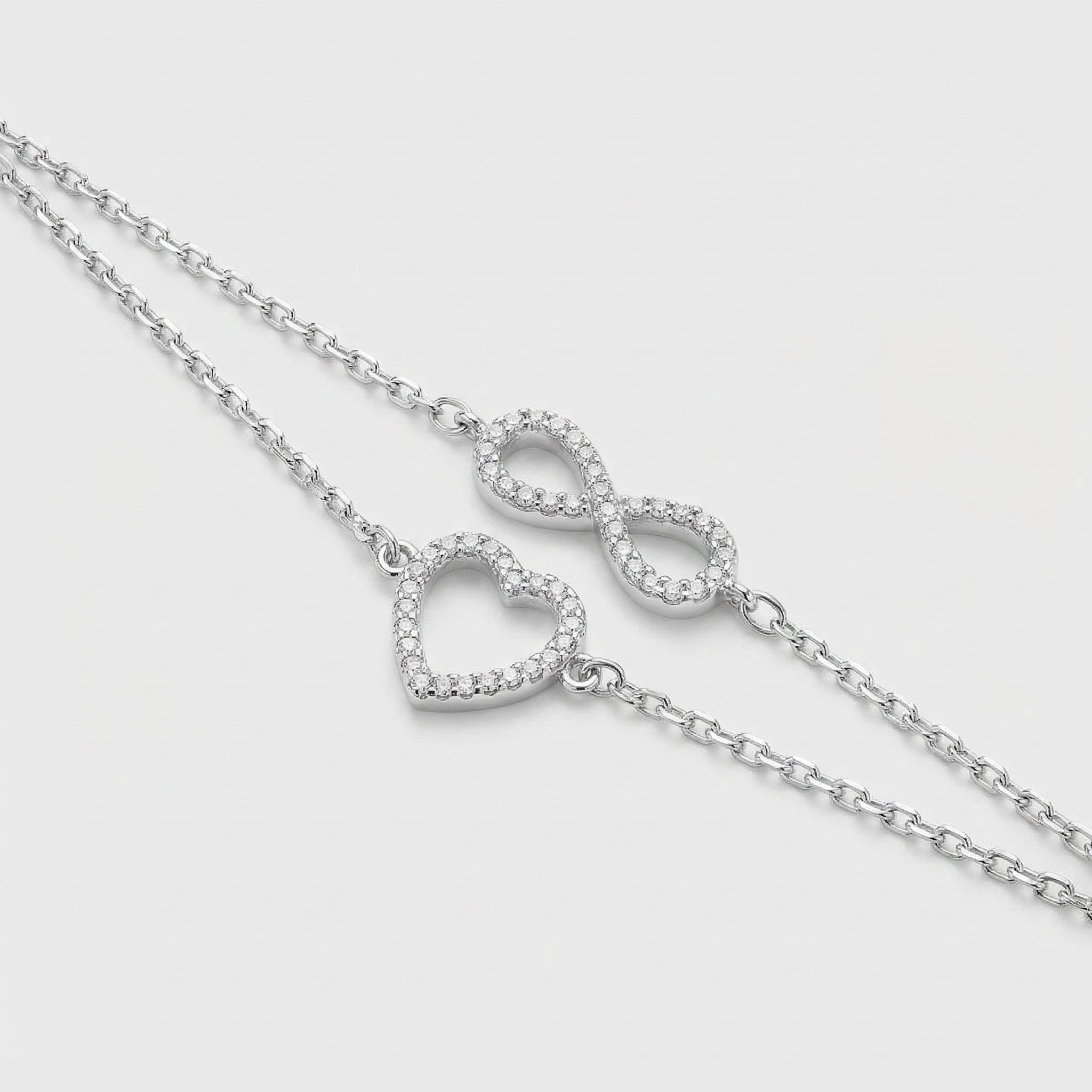 PULSEIRA DUPLA CORAÇÃO + INFINITO AMBOS CRAVEJADOS