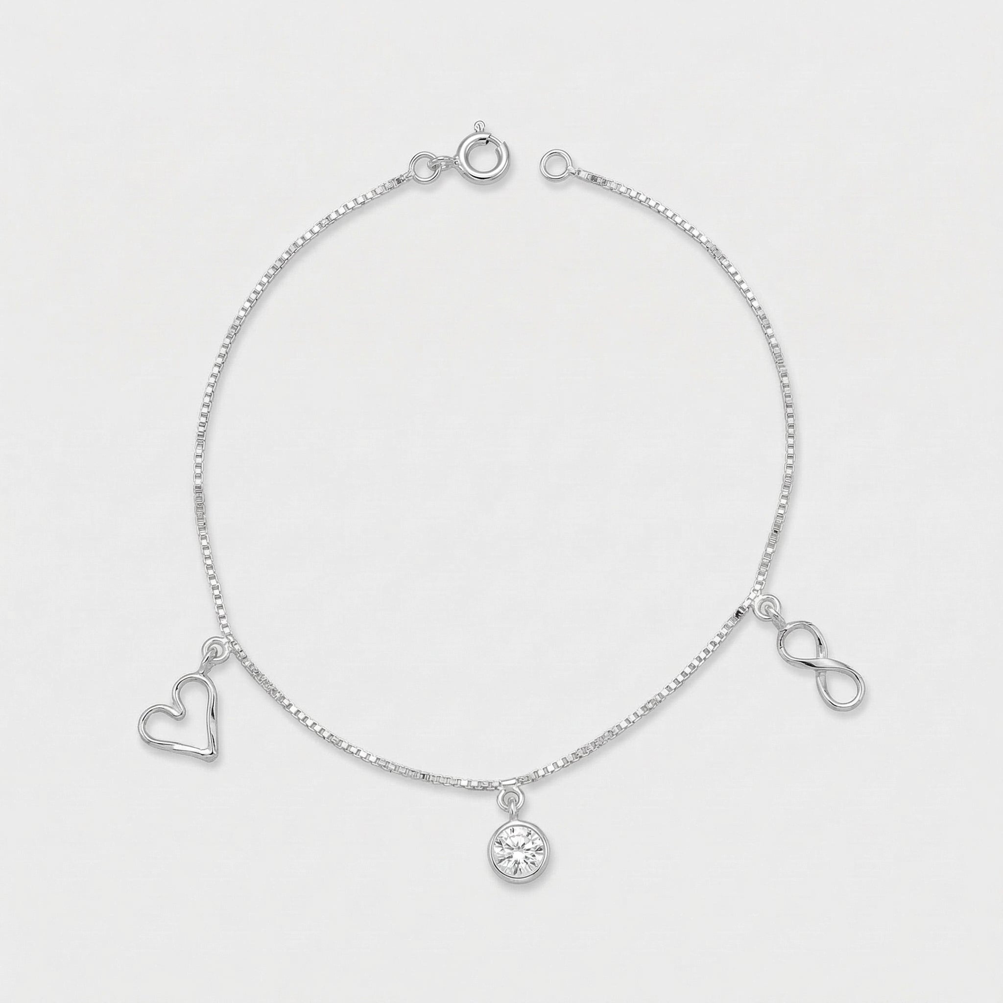 PULSEIRA COM PINGENTE DE CORAÇÃO, INFINITO E PONTO DE LUZ